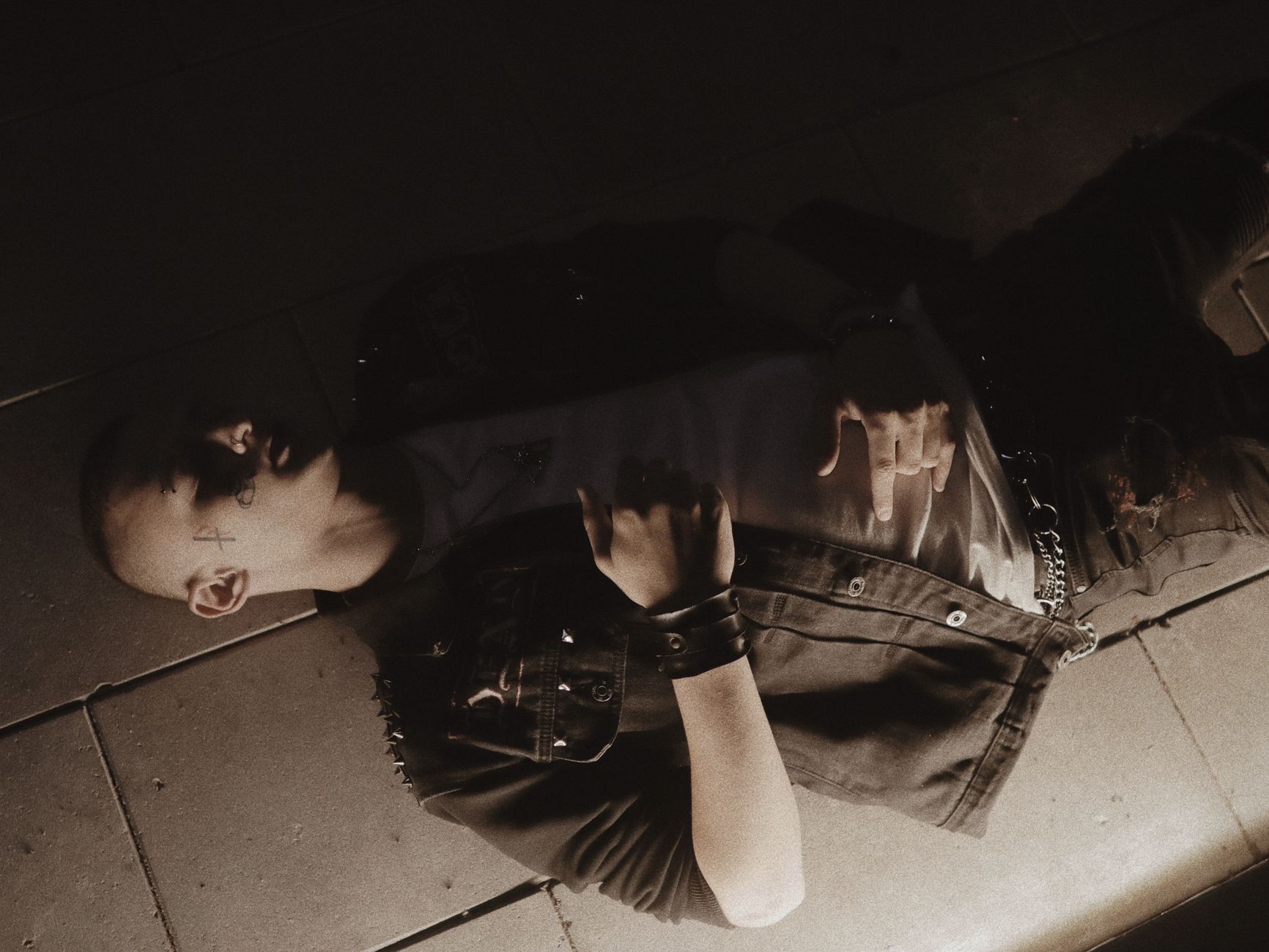 Goth punk outfit featuring leather jacket with studs and dark aesthetic fashion inspiration